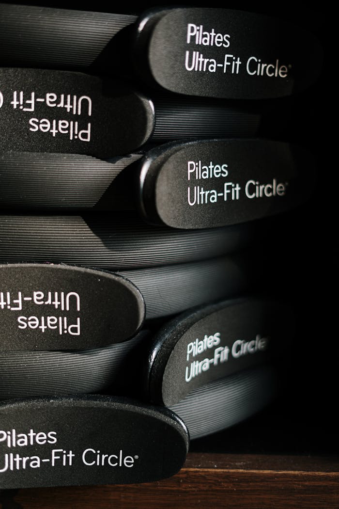 Close-up of Pilates Ultra-Fit Circles neatly stacked in a fitness center.